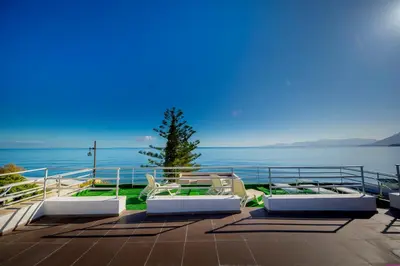 a patio with a view of the water at Appartamento 23 Pax in Villa Francesca by Ville in Palermo in Casteldaccia