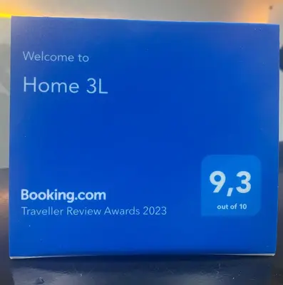 a blue sign that says welcome to home at Home 3L in Palermo