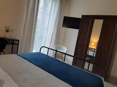 a bedroom with a bed and a dresser with a mirror at 