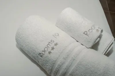 a pair of towels sitting on top of a toilet at Rooms 19 - Rooms and Breakfast in Palermo