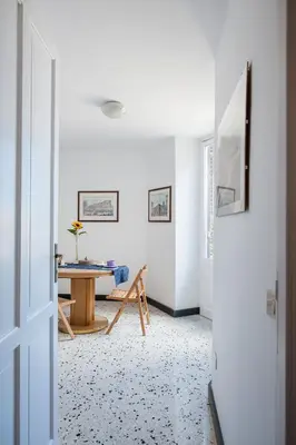 a living room with a table and a couch at B&B Castiglia in Palermo