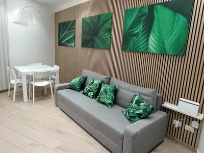 a living room with a couch and a table at Betta splendens in Palermo
