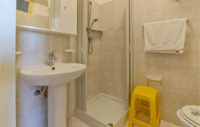 a bathroom with a shower and a sink and a toilet at La Casa Sul Mare in Trappeto