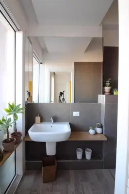 a bathroom with a sink and a mirror at Seaview Apartments in Palermo