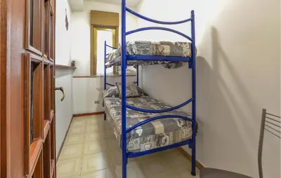 a blue ladder bunk bed in a room at Beautiful Apartment In Palermo Pa in Sferracavallo