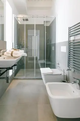 a bathroom with two sinks and a tub and a shower at Boutique BnB Dolcevita in Palermo
