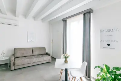 a living room with a couch and a table at Boutique BnB Dolcevita in Palermo
