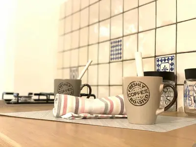 three coffee cups sitting on a counter in a kitchen at La Dimora della Cattedrale in Palermo