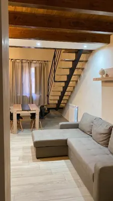 a living room with a couch and a table at Palazzo Liberty in Monreale