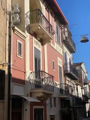 a building with balconies on the side of it at Palazzo Liberty in Monreale