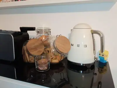 a counter top with a blender and jars of food at SuperAttico Bella Bellù in Palermo