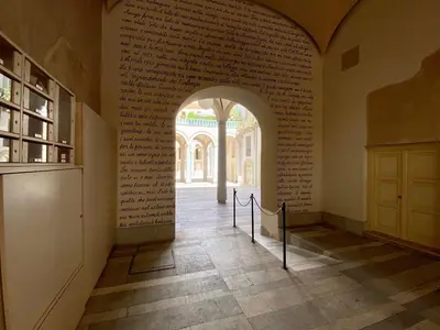 an archway in a room with books on the wall at One in Palermo
