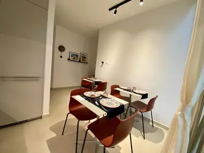 a dining room with chairs and tables in a room at One in Palermo