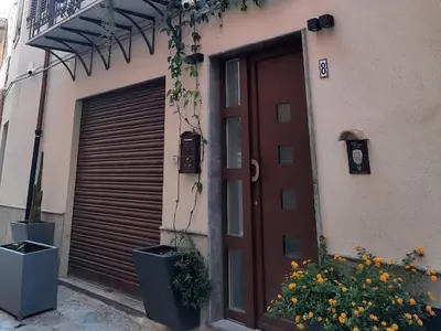 a door to a building with a garage at San Francesco Rooms and Apartment with Terrace in Palermo Locazione Turistica in Palermo