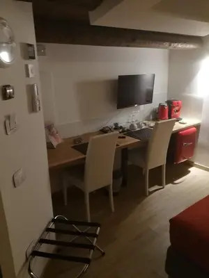 a room with a desk with chairs and a computer at San Francesco Rooms and Apartment with Terrace in Palermo Locazione Turistica in Palermo