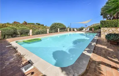 a large swimming pool in a yard at Mages in Casteldaccia