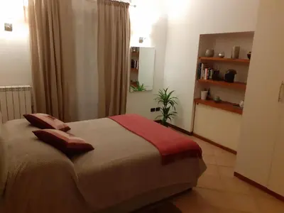 a bedroom with a bed with two pillows on it at Palazzo Edy&Stef 1 in Palermo