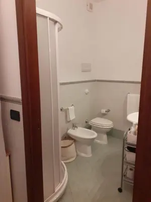 a bathroom with two toilets and a sink at Palazzo Edy&Stef 1 in Palermo
