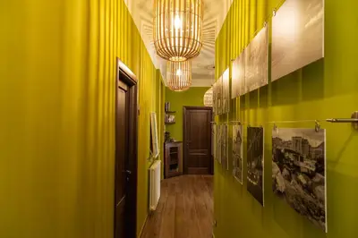 a hallway with green walls and a yellow wall at il Palchetto B&B di Charme e Design in Palermo