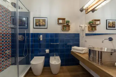 a bathroom with a toilet and a sink and a shower at il Palchetto B&B di Charme e Design in Palermo