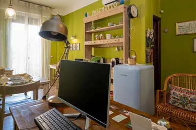 a computer monitor sitting on a desk in a room at il Palchetto B&B di Charme e Design in Palermo