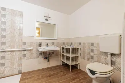 a bathroom with a toilet and a sink at Giulio Cesare 14, Residence in Palermo