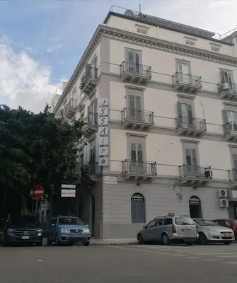 a store window with a sign for a hotel at 55 Aira Hotel in Palermo
