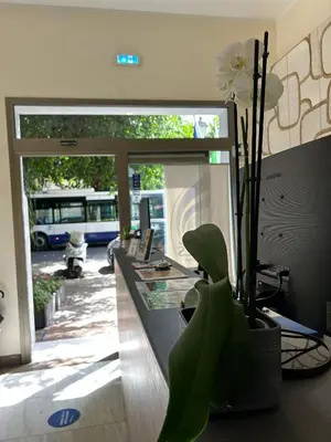 an office with a reception desk with a plant at 55 Aira Hotel in Palermo