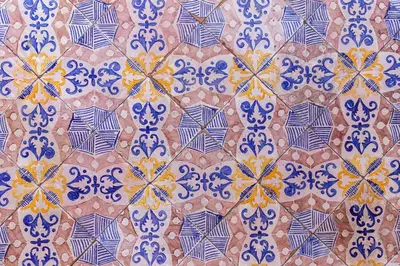 a tile floor with blue and yellow patterns on it at Ajutamicristo Domus by DomuSicily in Palermo