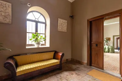 a living room with a couch and a window at Ajutamicristo Domus by DomuSicily in Palermo