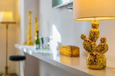 a yellow lamp sitting on a counter in a room at Palazzo Ardizzone in Palermo