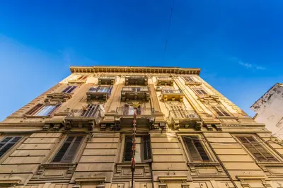 a tall building with windows on the side of it at Palazzo Ardizzone in Palermo