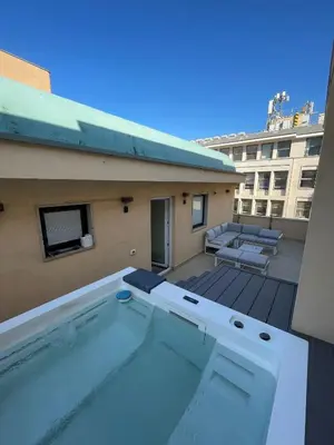 a swimming pool on top of a building at B&B Ruggero Settimo - Room & Suite in Palermo