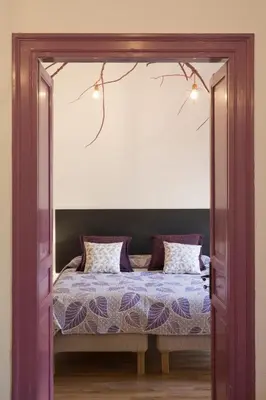 a bedroom with a bed with a mirror over it at Large apartment near Politeama 2 bathrooms Up to 8 Guests in Palermo