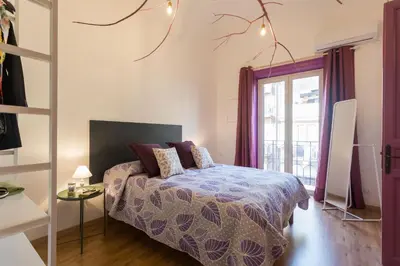 a bedroom with a bed and a window at Large apartment near Politeama 2 bathrooms Up to 8 Guests in Palermo