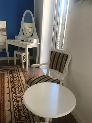 a dressing room with a white table and a mirror at Charmie flat in Palermo
