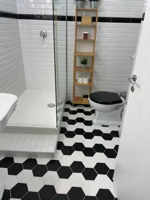 a bathroom with a shower and a toilet and a sink at Charmie flat in Palermo