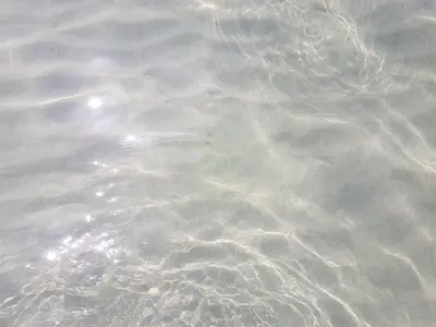a close up of the water with ripples at Kalimera in Capaci