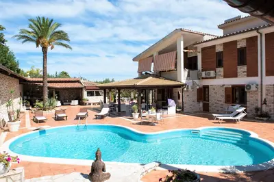a swimming pool in front of a house at Villa Blondie con piscina a Castellammare del Golfo in Castellammare del Golfo
