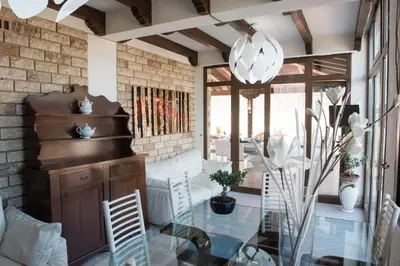 a dining room with a glass table and chairs at Villa Blondie con piscina a Castellammare del Golfo in Castellammare del Golfo