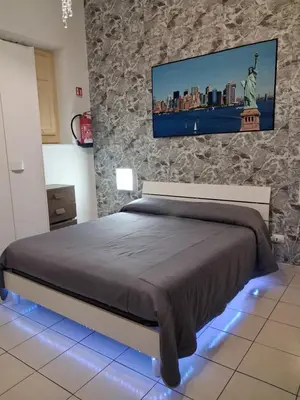 a bedroom with the statue of liberty on the wall at Monfenera Apartment 2 in Palermo