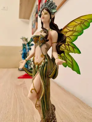 a figurine of a fairy sitting on a table at Monfenera Apartment 2 in Palermo