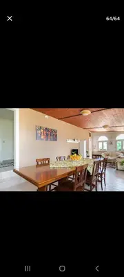 a kitchen and dining room with a table and chairs at Villa Teresa in Trappeto