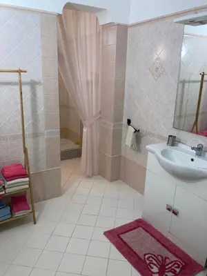 a bathroom with a sink and a shower at Casa Igiea in Palermo