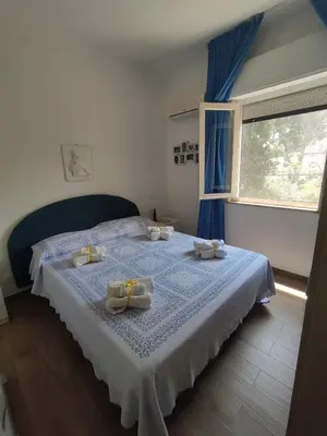 a bedroom with a bed with two dishes on it at Guisomar in Palermo