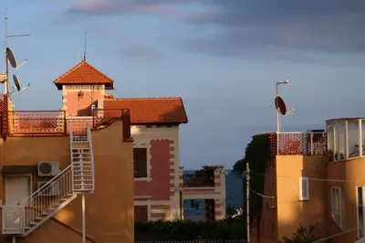 a building with a fire escape on the side of it at Guisomar in Palermo