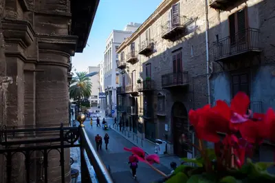 a view of a street with people walking down the street at Casa MaMo 36 in Palermo