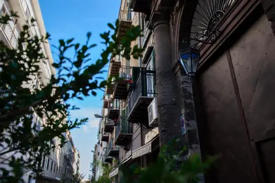 a building with balconies on the side of it at Casa MaMo 36 in Palermo
