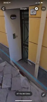 a door to a building with a sign on it at Interno12 in Palermo