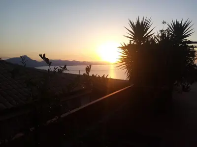 a sunset seen from the roof of a house at Villa Verde in Cefalù